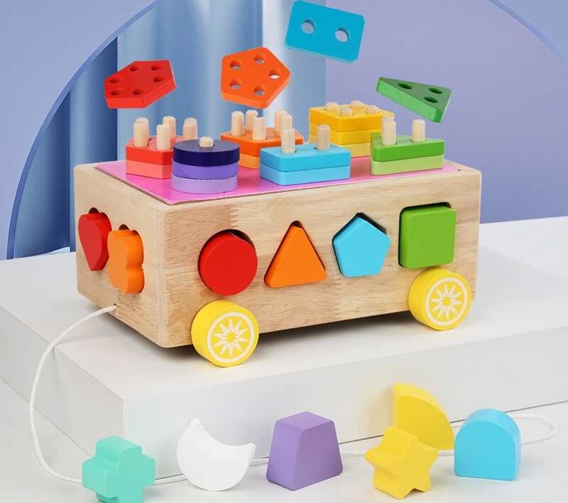 Каталка C 75630 (30) дерев’яна, сортер, кілочки, в коробці